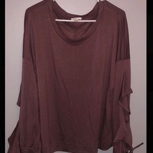Plum colored top with ruffled sleeves that tie.
